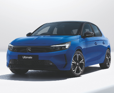 Blue hatchback car, front and side view, badge on front grille and label on bumper saying Ultimate.