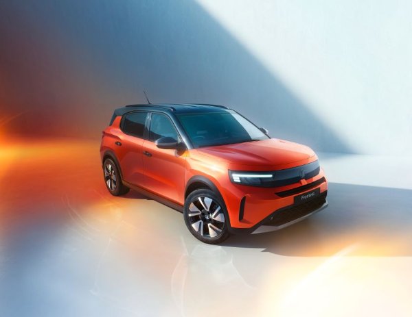Red-orange car in an angled side view, showing sleek design and black roof.