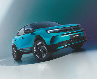Turquoise Mokka SUV with black trim shown from the front-left angle.